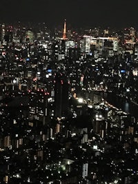 a view of a city at night from the top of a building