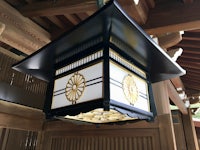 a lantern hanging from the ceiling of a building