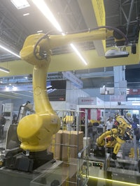 a yellow robot in a factory